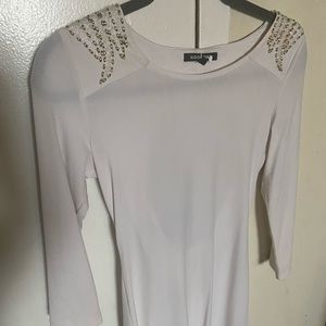 Short Dress long sleeve back is open what a stud on the shoulder and back